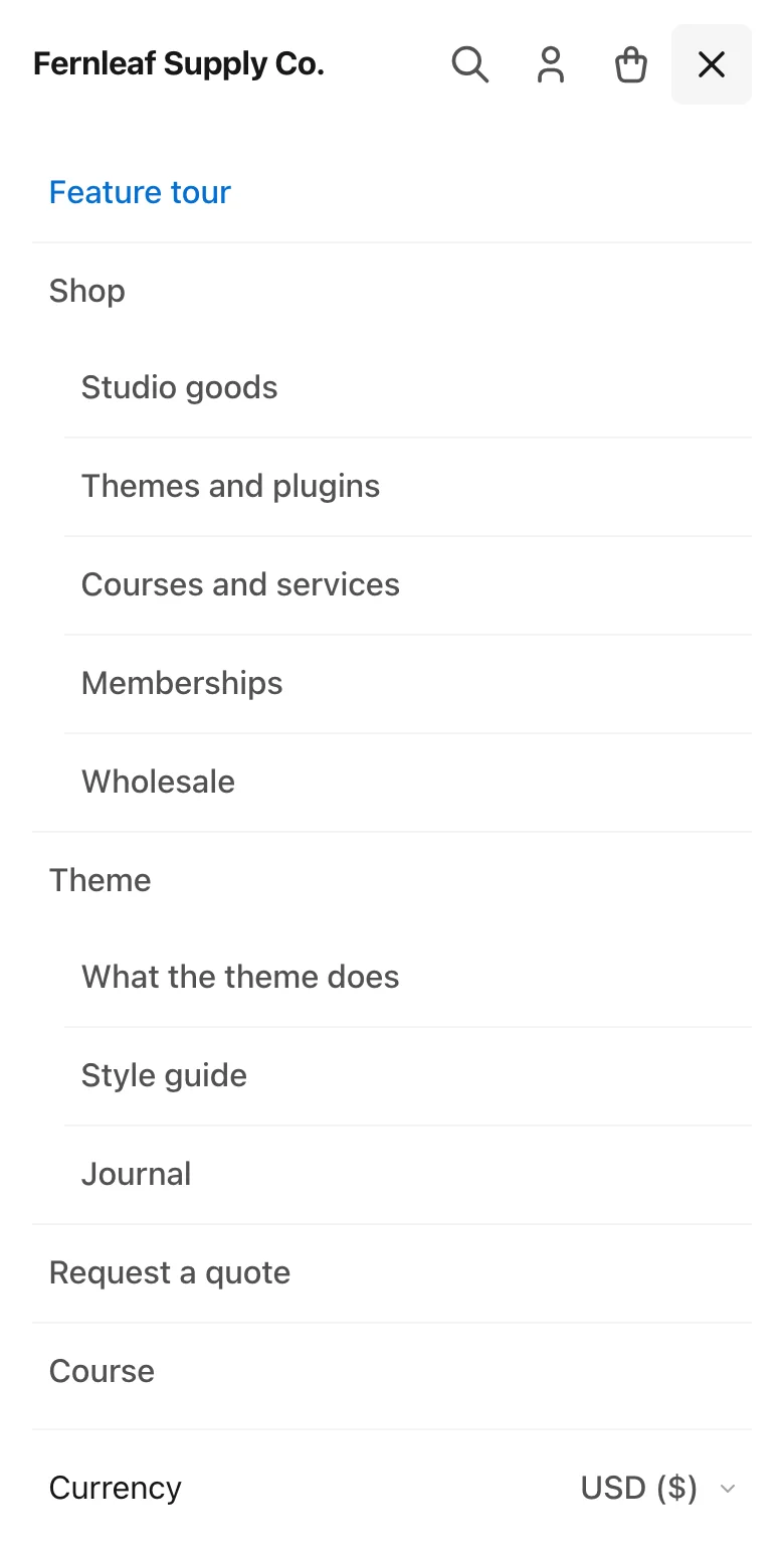 Stackless theme mobile menu with two-level navigation and the currency switcher at the bottom